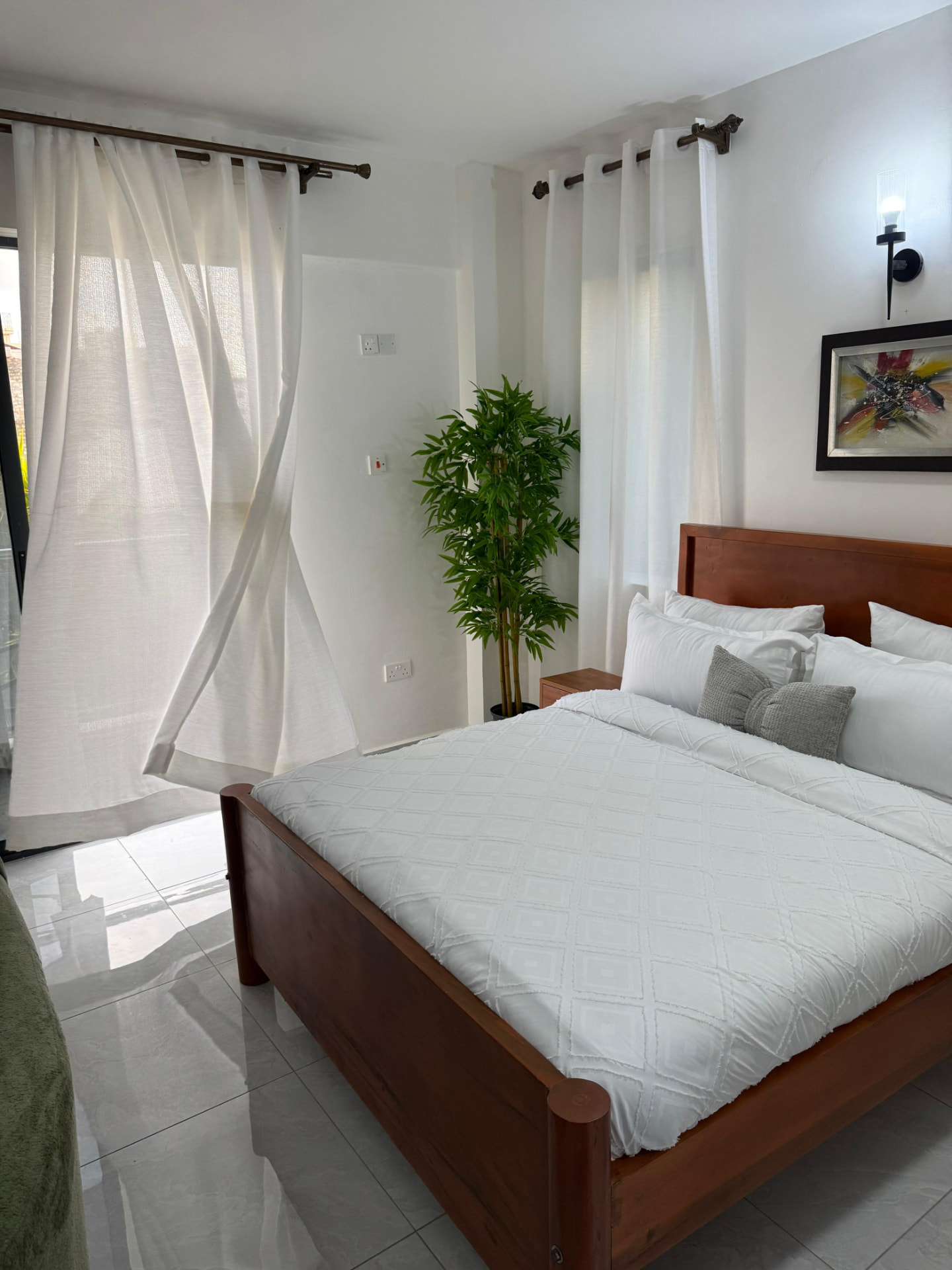 Bright bedroom with crisp white linen bedding